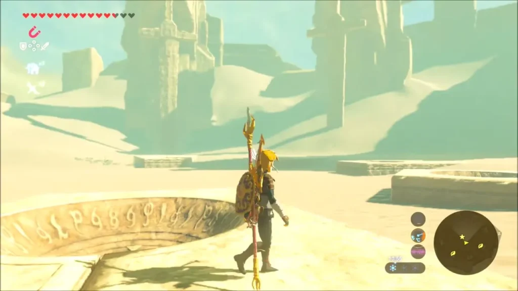 Link walking past a stone dish ringed with carved symbols in the desert Link walking past a stone dish ringed with carved symbols in the desert