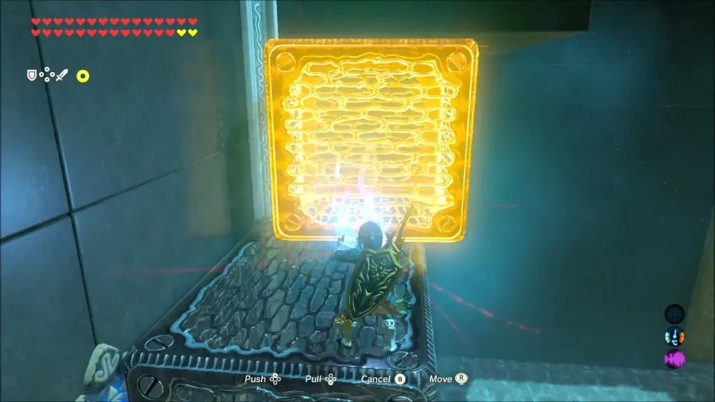 Link on top of a box pulling a metal block with Magnesis in Mah Eliya Shrine Link on top of a box pulling a metal block with Magnesis in Mah Eliya Shrine