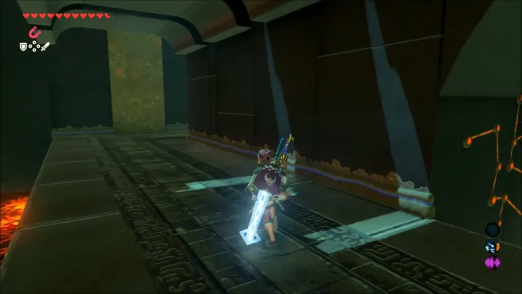 Link walking down a corridor edged with lava in Maka Rah Shrine Link walking down a corridor edged with lava in Maka Rah Shrine