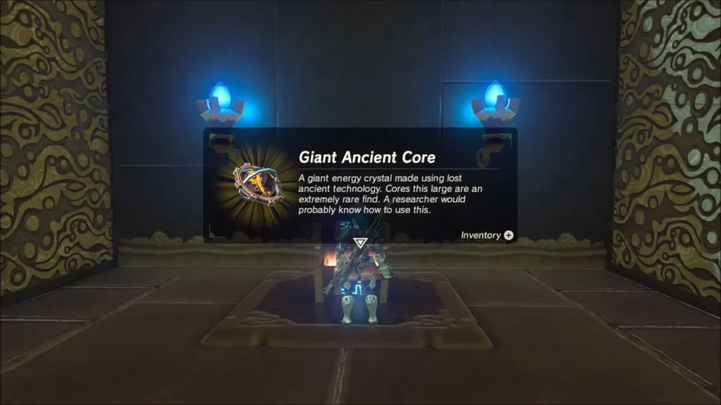 Link holding up the Giant Ancient Core from the chest Link holding up the Giant Ancient Core from the chest