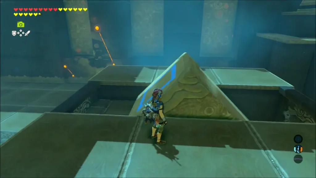 Link beside a stone pyramid piece of the shrine mechanism Link beside a stone pyramid piece of the shrine mechanism