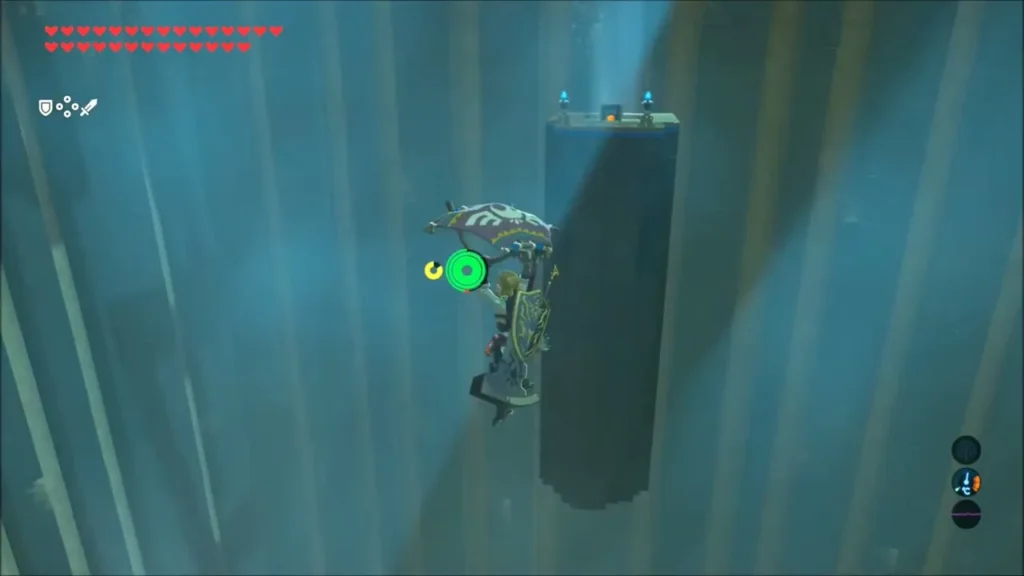 Link gliding beside a tall pillar topped by a lone platform in Noe Rajee Shrine Link gliding beside a tall pillar topped by a lone platform in Noe Rajee Shrine