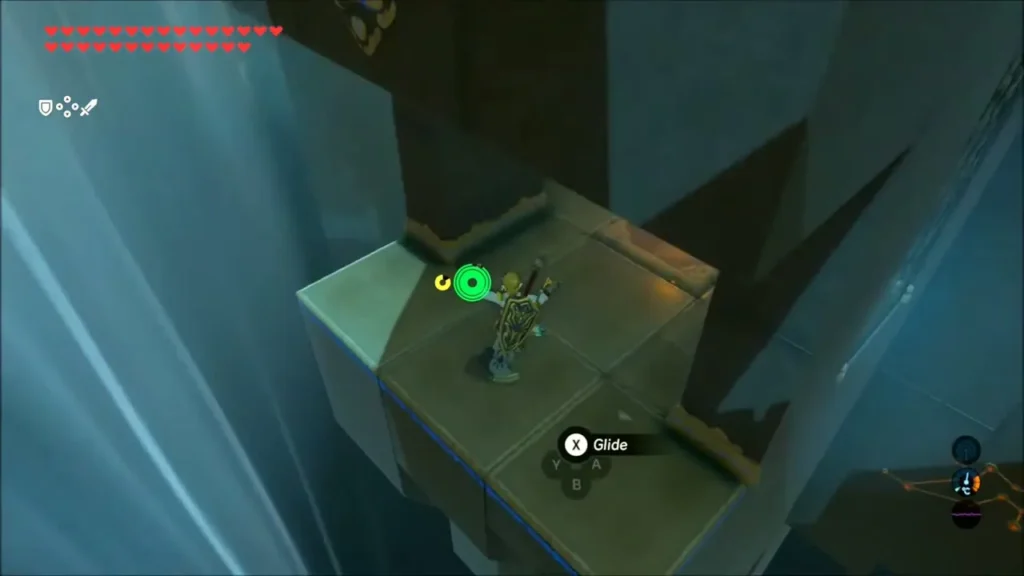 Link standing on a ledge inside the gust tower, ready to glide Link standing on a ledge inside the gust tower, ready to glide