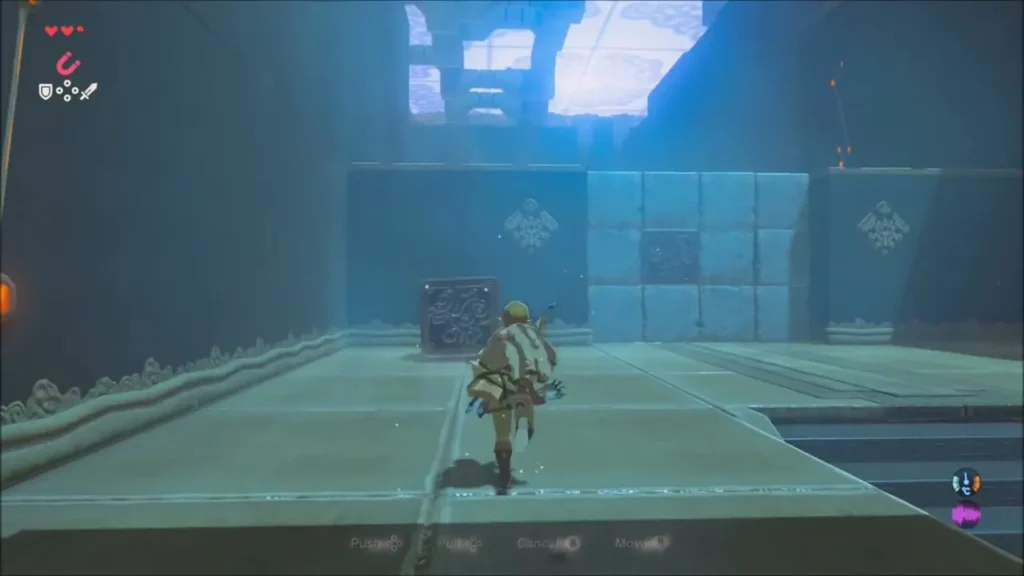 Link facing a wall of stone blocks in the chamber Link facing a wall of stone blocks in the chamber