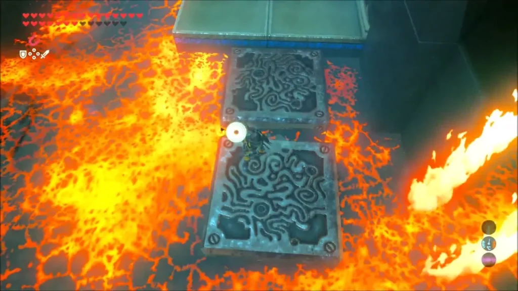 Two metal blocks laid as stepping stones over lava past a flame