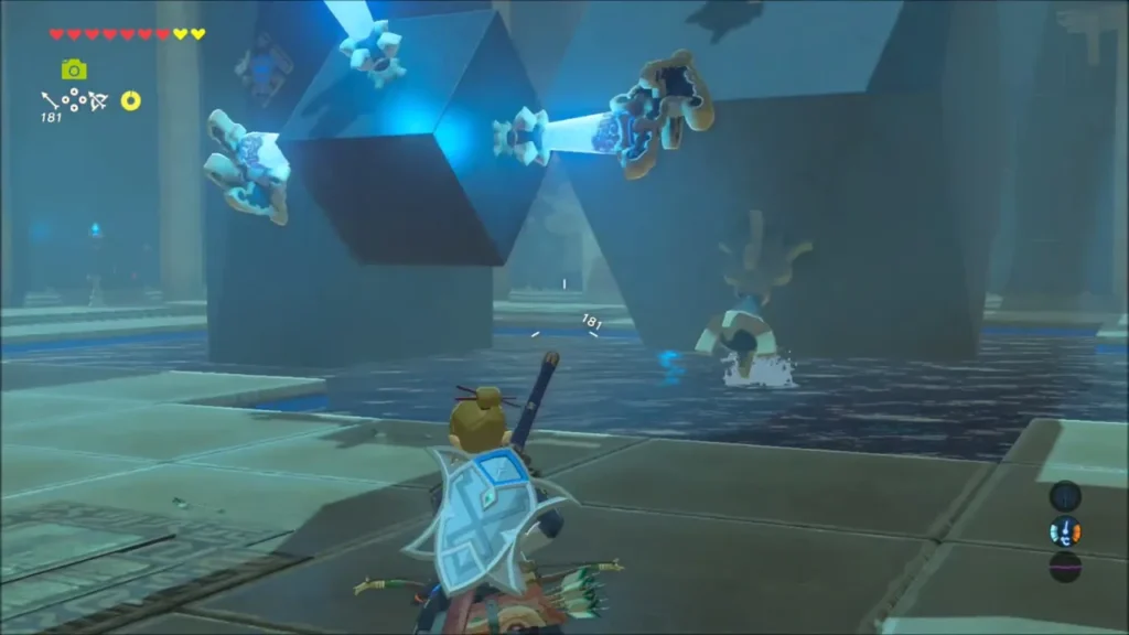 The cube glowing blue after a switch is hit, torch stands above the water