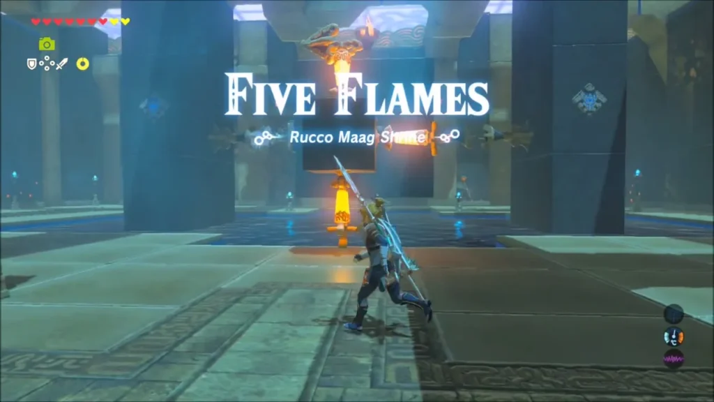 Five Flames title over the block room with a lit torch stand beside the water