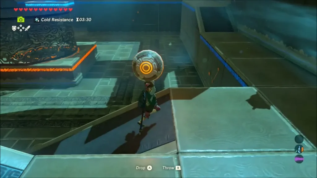 Link carrying the metal orb along a stone ramp in Shada Naw Shrine Link carrying the metal orb along a stone ramp in Shada Naw Shrine