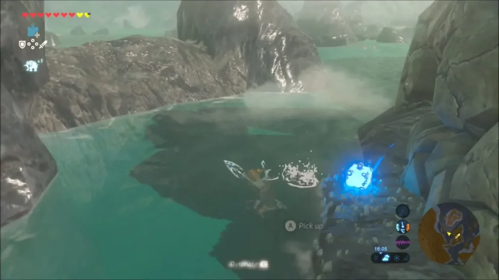 Link swimming toward a bomb in the lagoon near the breakable rocks Link swimming toward a bomb in the lagoon near the breakable rocks