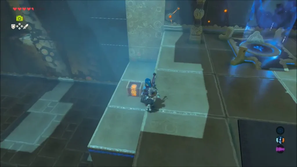 Link on a lower ledge beside a small chest inside the shrine Link on a lower ledge beside a small chest inside the shrine