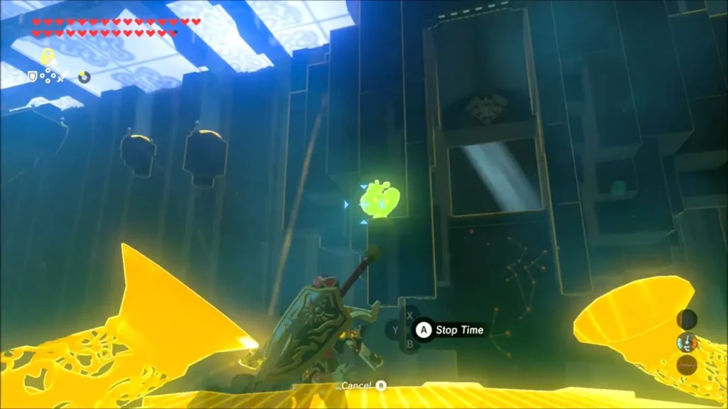 Link using Stasis to freeze the fan before the gate, Stop Time prompt shown Link using Stasis to freeze the fan before the gate, Stop Time prompt shown