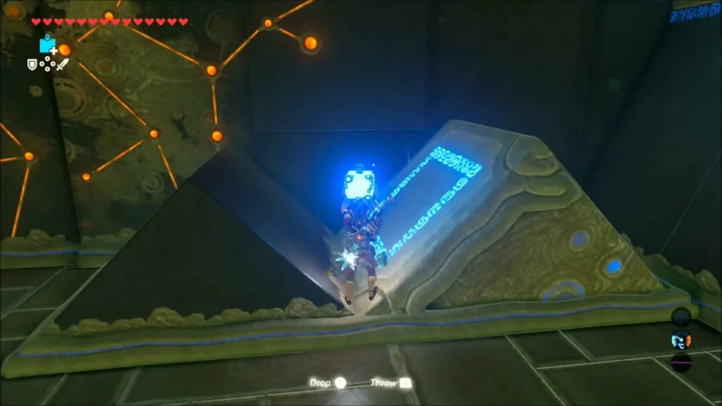 Link placing a bomb on the angled pillar's glowing face Link placing a bomb on the angled pillar's glowing face