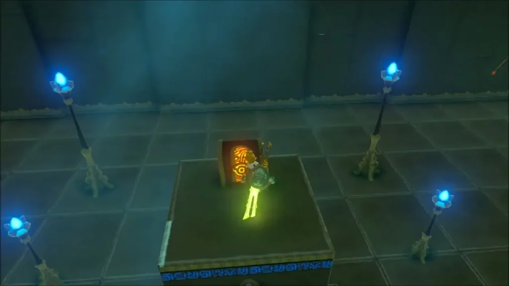 Link beside the glowing chest on its raised platform Link beside the glowing chest on its raised platform