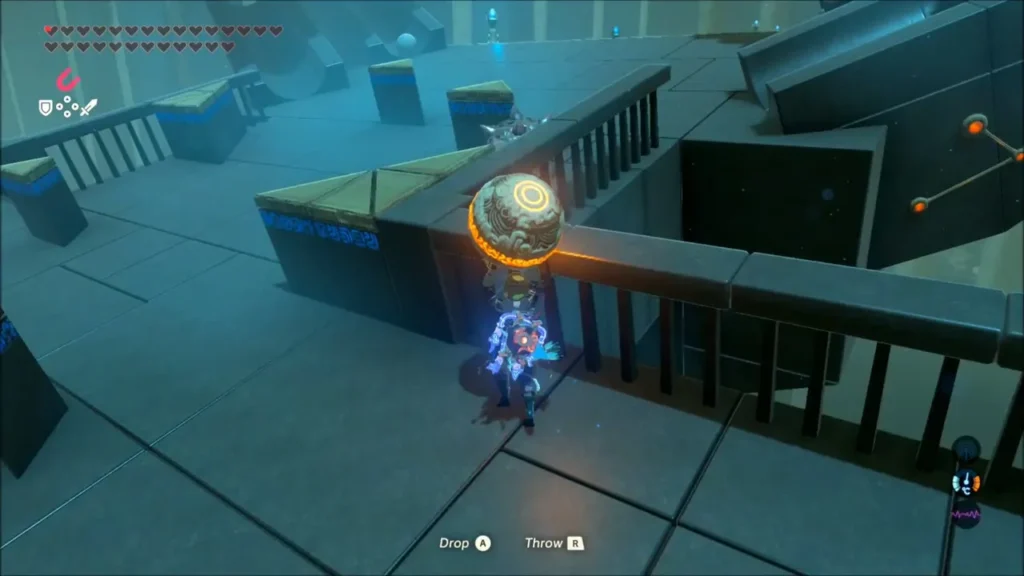 Link carrying an orb along a railed catwalk past a spiked ball Link carrying an orb along a railed catwalk past a spiked ball