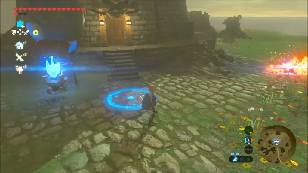 Link with the lit torch beside the Sheikah pad in front of the lab Link with the lit torch beside the Sheikah pad in front of the lab
