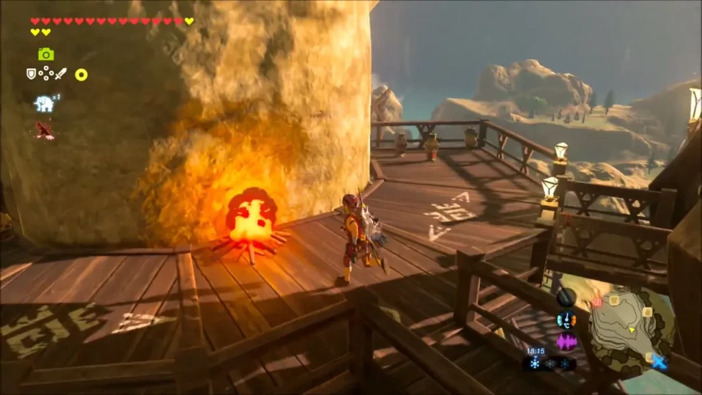 Link beside a burning campfire on the wooden walkway