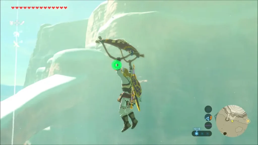 Link gliding with the paraglider up past a snowy cliff ledge Link gliding with the paraglider up past a snowy cliff ledge