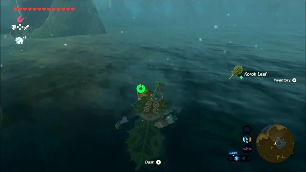 Link swimming toward a Korok Leaf floating on the water Link swimming toward a Korok Leaf floating on the water