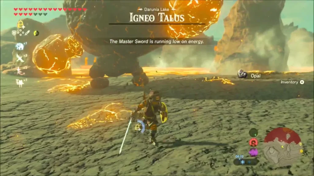 Link backing away from the Igneo Talus's heavy fists Link backing away from the Igneo Talus's heavy fists