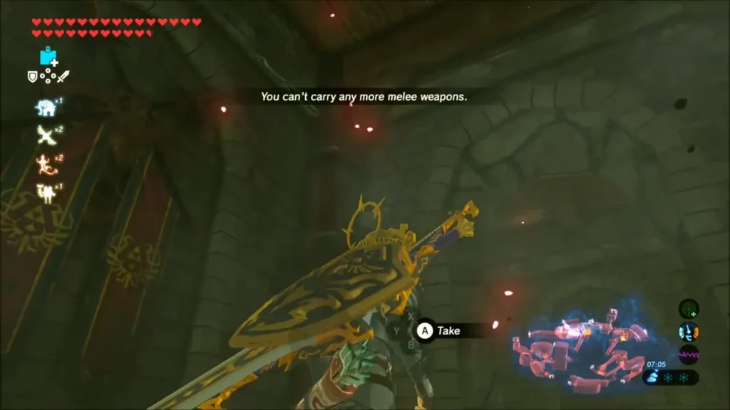 Link at a weapon pickup prompt in the dark castle cells, holding a large blade Link at a weapon pickup prompt in the dark castle cells, holding a large blade