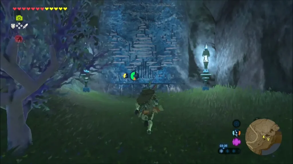 Link running up to a Zora stone monument beside a glowing lantern Link running up to a Zora stone monument beside a glowing lantern