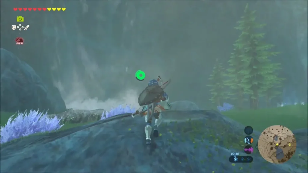 Link on a rock ledge beside a waterfall heading inland Link on a rock ledge beside a waterfall heading inland