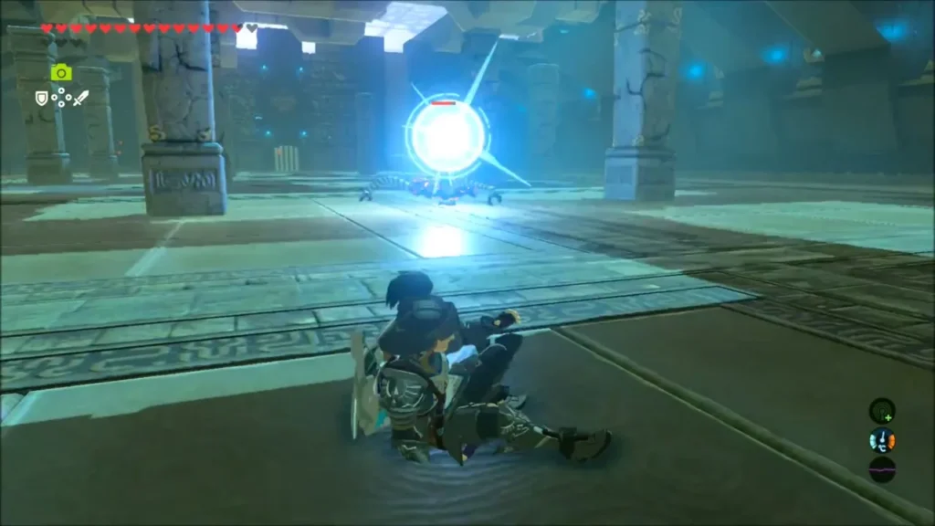 Link on the floor as the Guardian Scout charges a bright laser Link on the floor as the Guardian Scout charges a bright laser