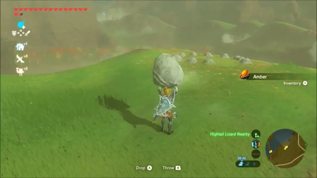 Link carrying a boulder across the grass toward a ring of stones on the hill Link carrying a boulder across the grass toward a ring of stones on the hill