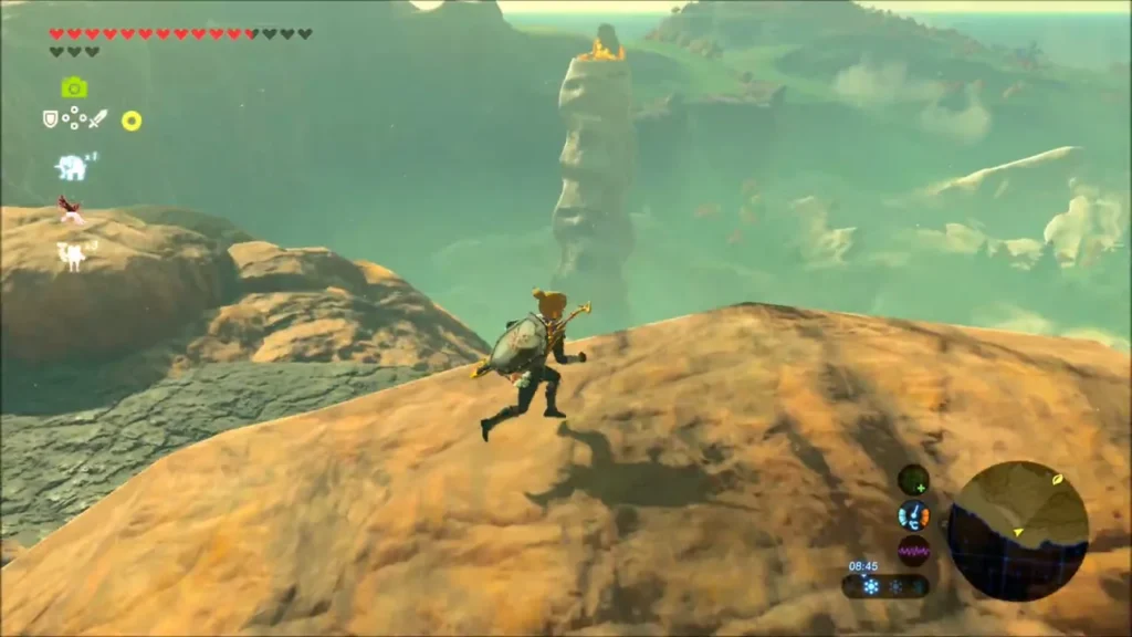 Link running across red hills with the white pillar in the distance Link running across red hills with the white pillar in the distance