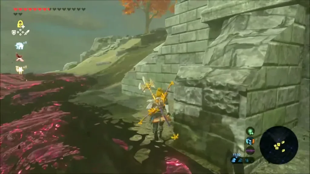 Link walking past a ruined stone wall toward the rubble slope Link walking past a ruined stone wall toward the rubble slope