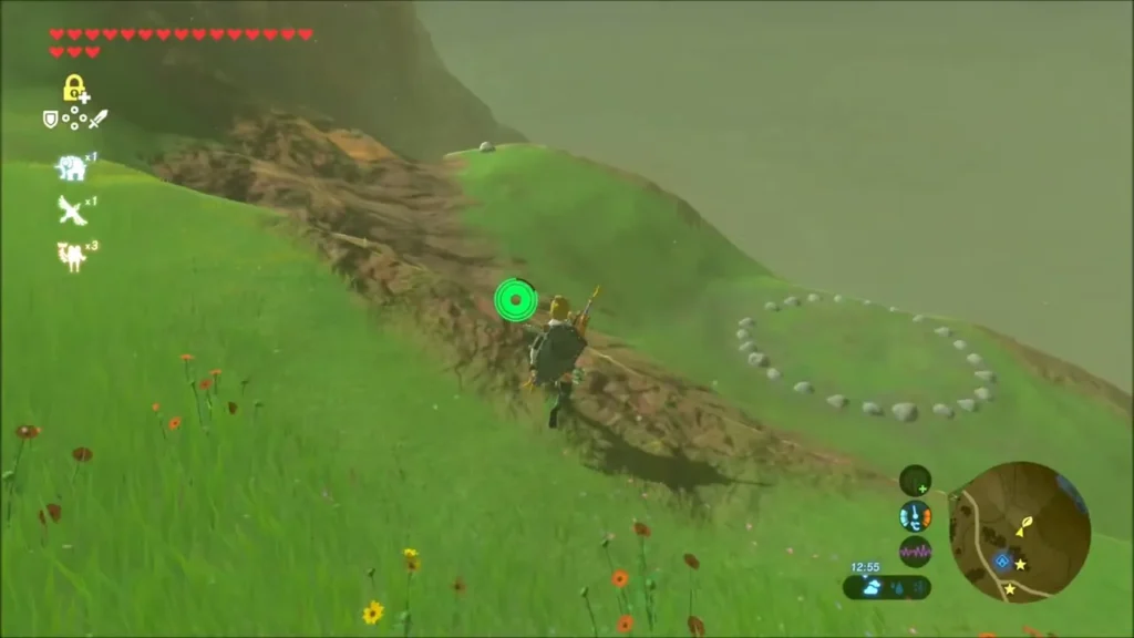 A ring of small stones on the grassy hillside slope A ring of small stones on the grassy hillside slope