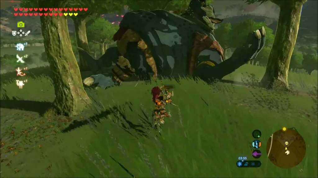 A Hinox lying in the grass between trees as Link approaches A Hinox lying in the grass between trees as Link approaches