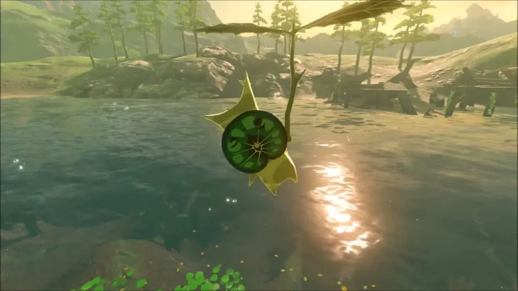 A Korok hanging from its leaf above the open water of the lake A Korok hanging from its leaf above the open water of the lake