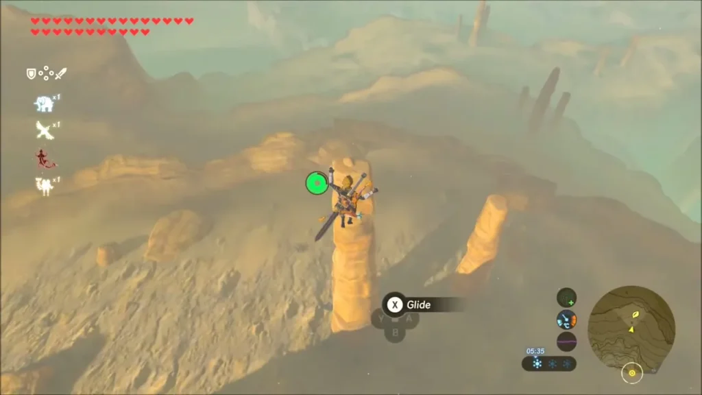 Link gliding toward a tall sandstone pinnacle in the canyon where a Korok waits Link gliding toward a tall sandstone pinnacle in the canyon where a Korok waits