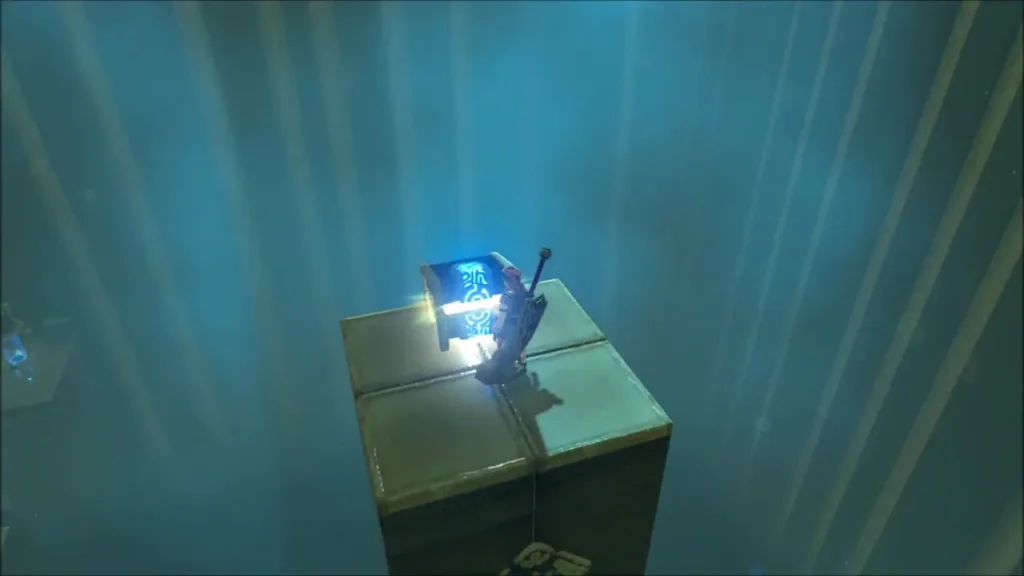 Link standing beside a glowing chest on a small stone platform in the shrine Link standing beside a glowing chest on a small stone platform in the shrine
