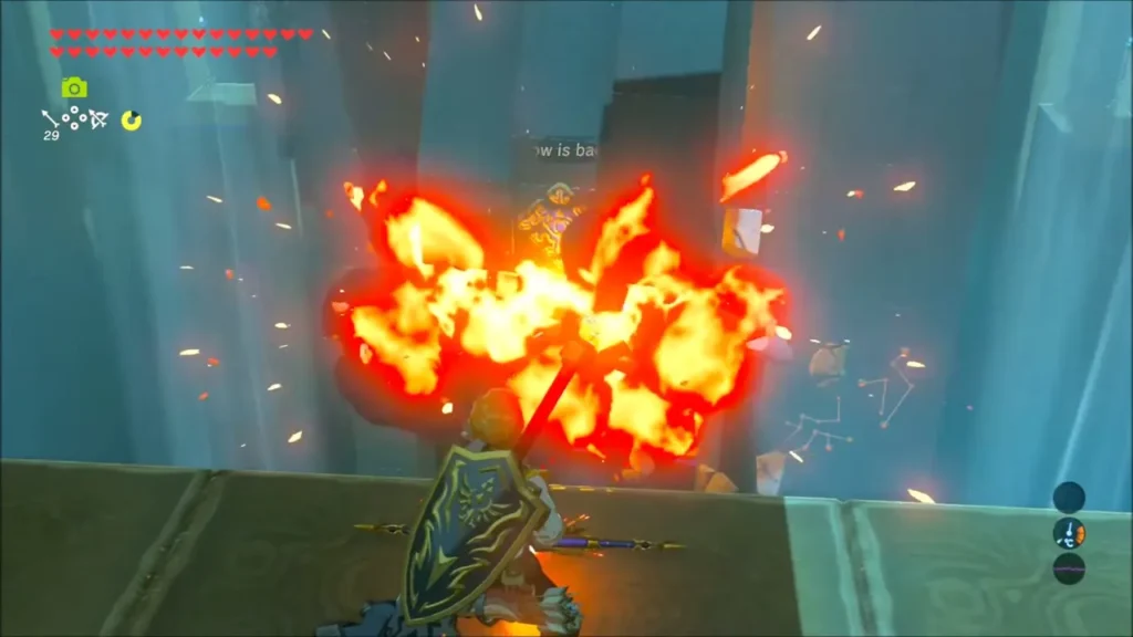 A bomb exploding against the cracked wall section A bomb exploding against the cracked wall section