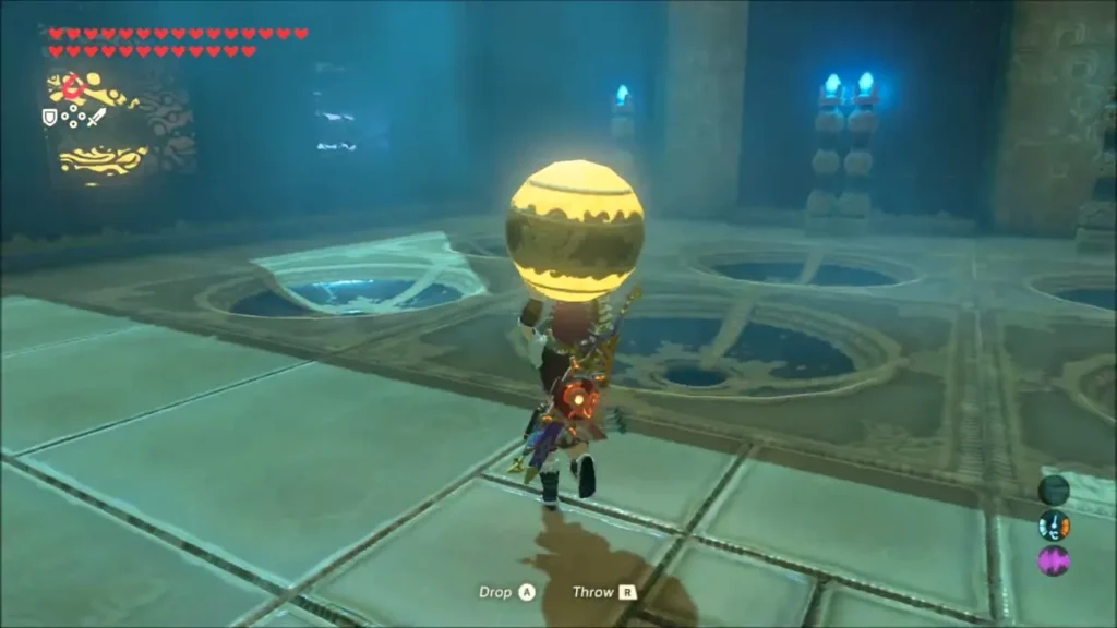 Link carrying a glowing yellow orb across the floor of colour slots Link carrying a glowing yellow orb across the floor of colour slots