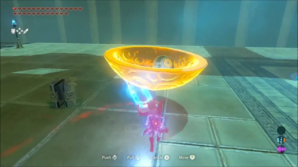 Link using Magnesis to hold a glowing bowl with a small orb inside Link using Magnesis to hold a glowing bowl with a small orb inside