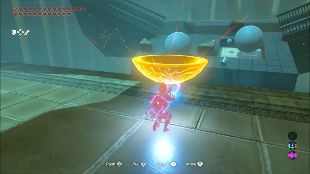 Link using Magnesis to lift a golden bowl across the vault room Link using Magnesis to lift a golden bowl across the vault room