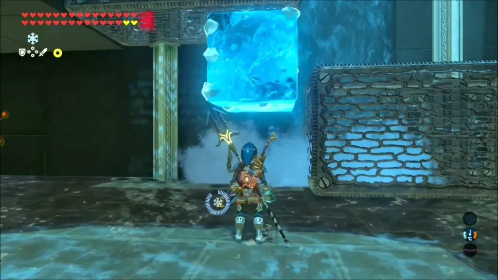 Link raising a Cryonis ice block beside a metal box under the waterfall Link raising a Cryonis ice block beside a metal box under the waterfall