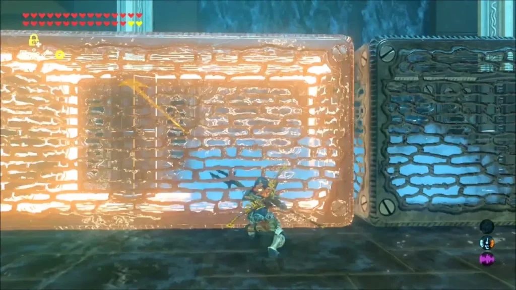 Link lifting a metal box with Magnesis beside a second box in Mah Eliya Shrine Link lifting a metal box with Magnesis beside a second box in Mah Eliya Shrine