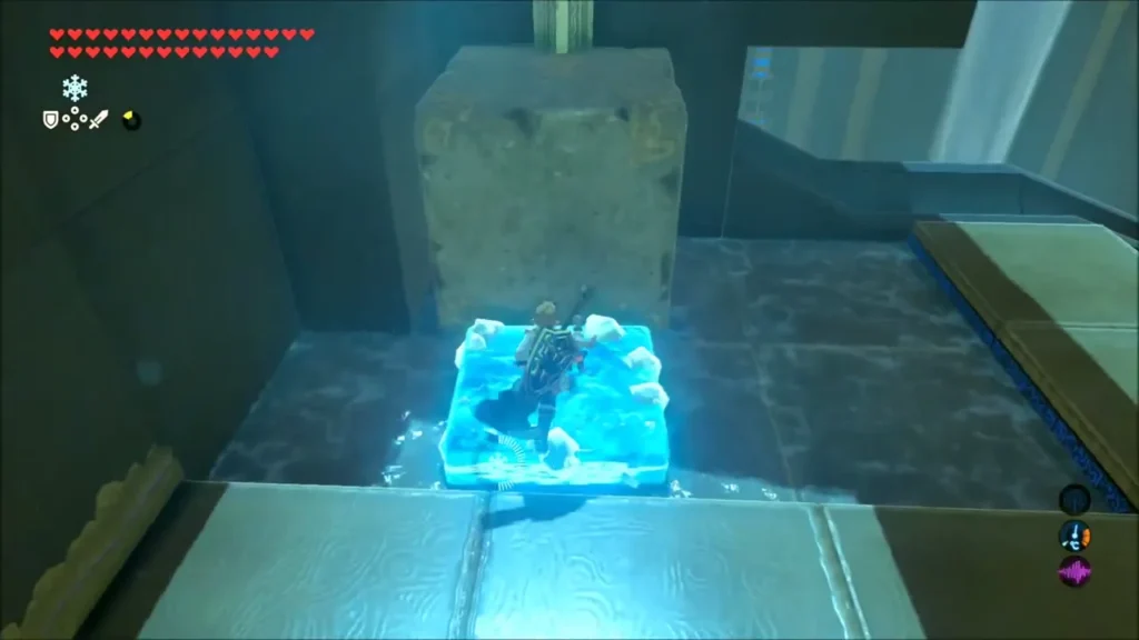 Link standing on a Cryonis ice block beside a large stone block Link standing on a Cryonis ice block beside a large stone block