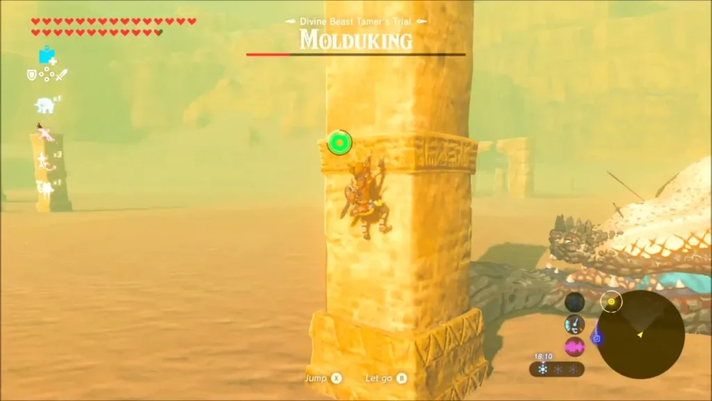 Link clinging to a stone pillar while the Molduking lies stunned beside it Link clinging to a stone pillar while the Molduking lies stunned beside it