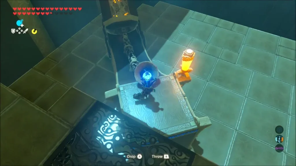 Link holding a Round Remote Bomb at the bomb cannon receptacle Link holding a Round Remote Bomb at the bomb cannon receptacle