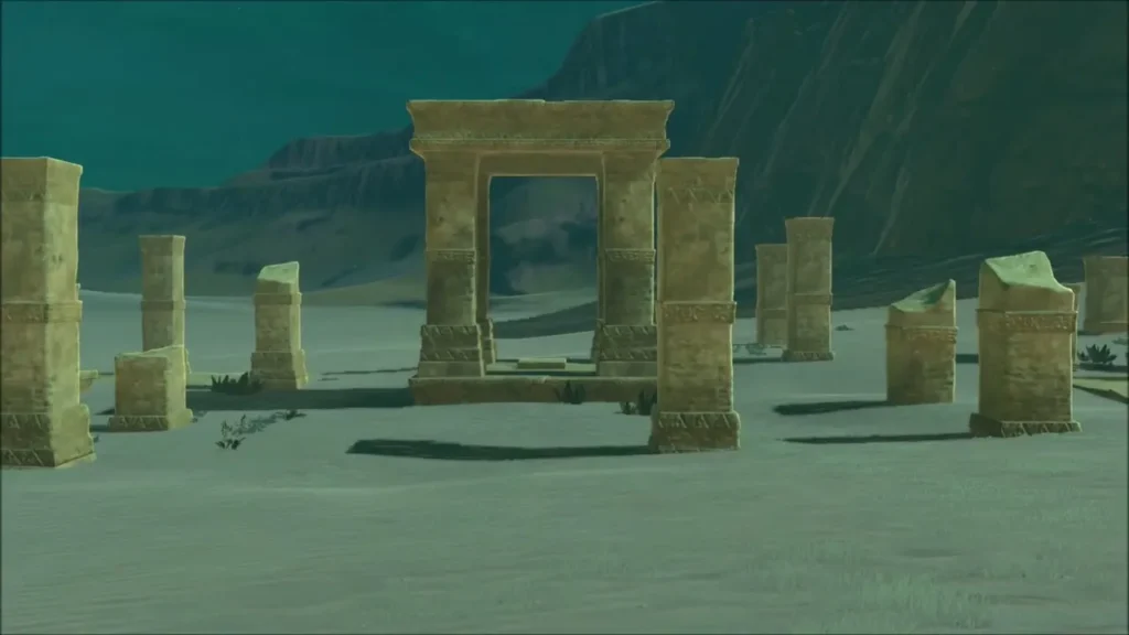 Ruined stone gateway and pillars in the sand where the ring trail ends Ruined stone gateway and pillars in the sand where the ring trail ends