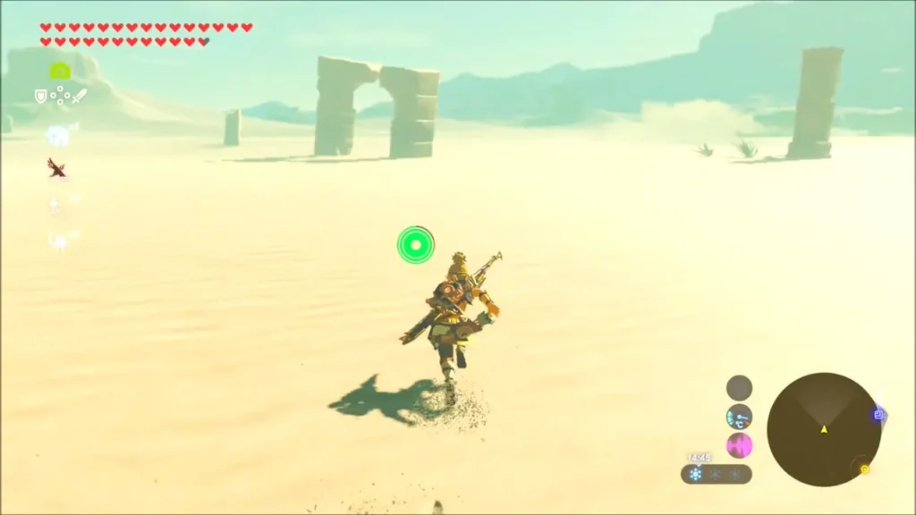 Link running across open sand dunes toward distant ruins Link running across open sand dunes toward distant ruins