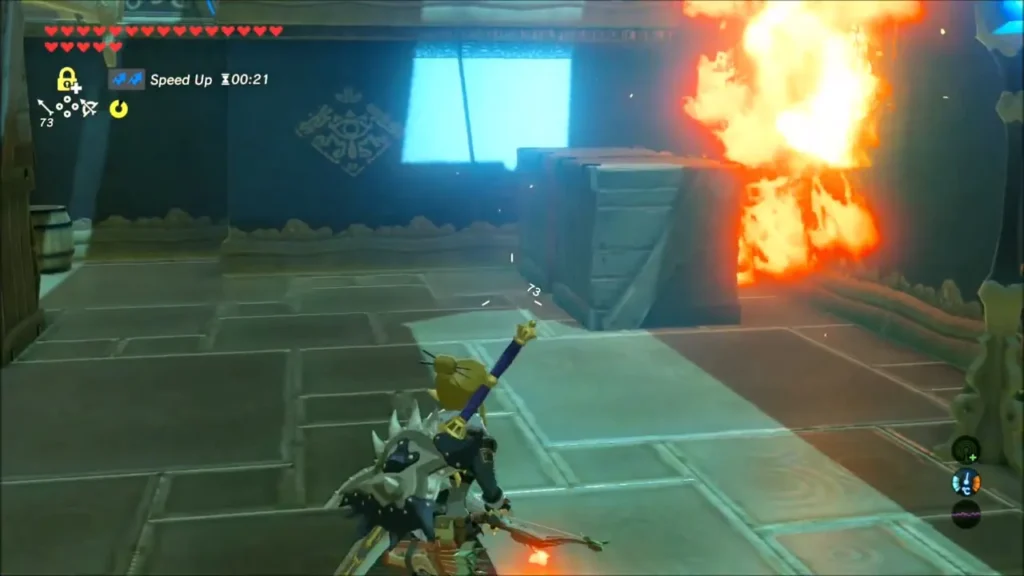 Link raising a flaming torch beside burning crates in the shrine hall Link raising a flaming torch beside burning crates in the shrine hall