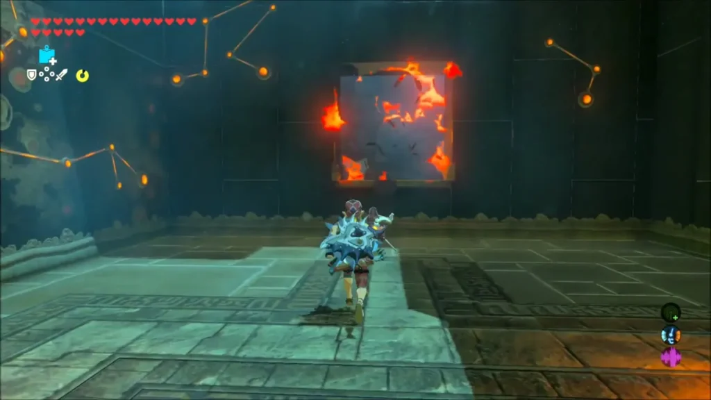 Link walking toward a wall of burning crates in the first shrine room Link walking toward a wall of burning crates in the first shrine room