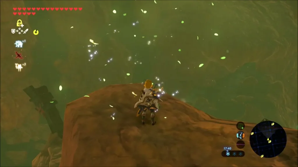 Link landing on a rocky ledge amid sparkles after finishing the glide Link landing on a rocky ledge amid sparkles after finishing the glide