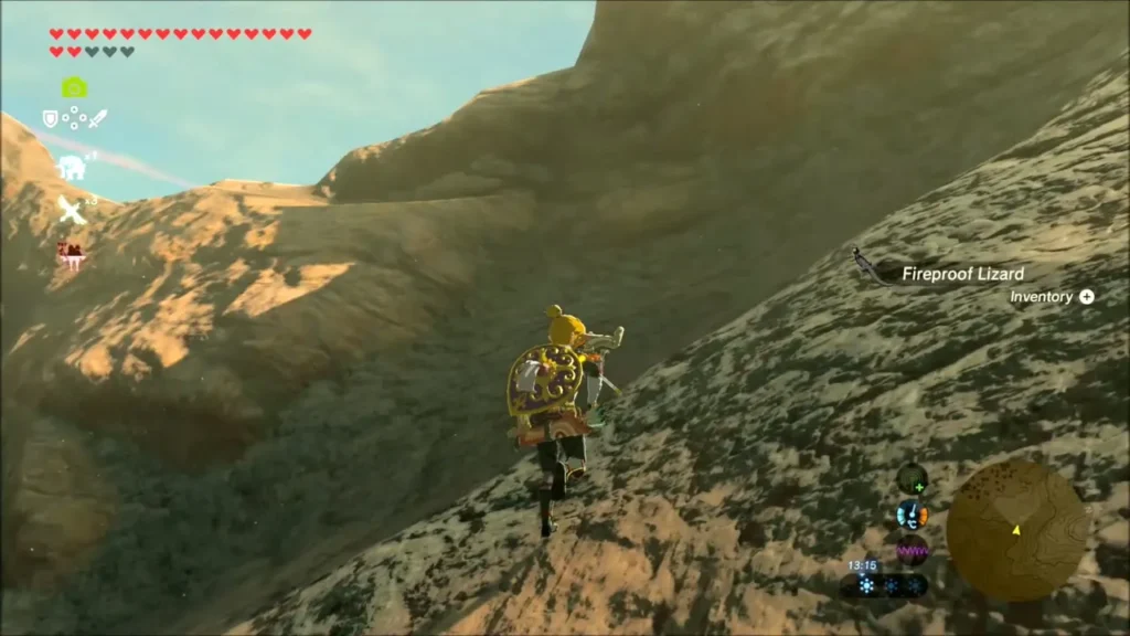 Link climbing a ridge and collecting another Fireproof Lizard Link climbing a ridge and collecting another Fireproof Lizard